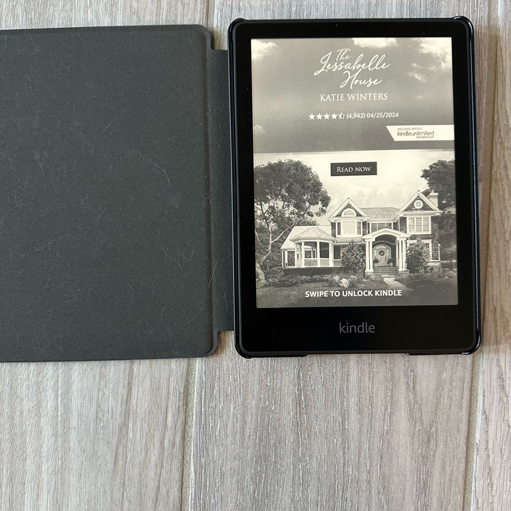 Perfect condition Kindle Paperwhite with purple leather case.